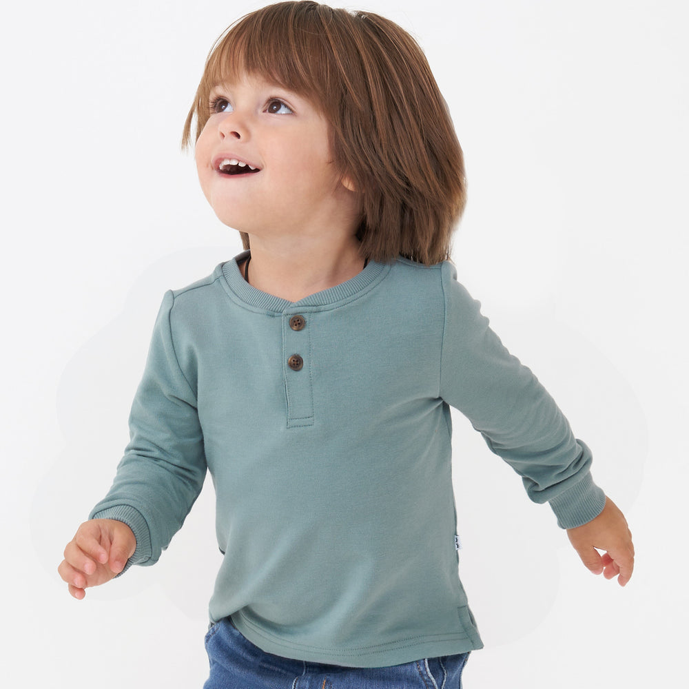 Alternate close up image of a child wearing a Vintage Teal henley tee