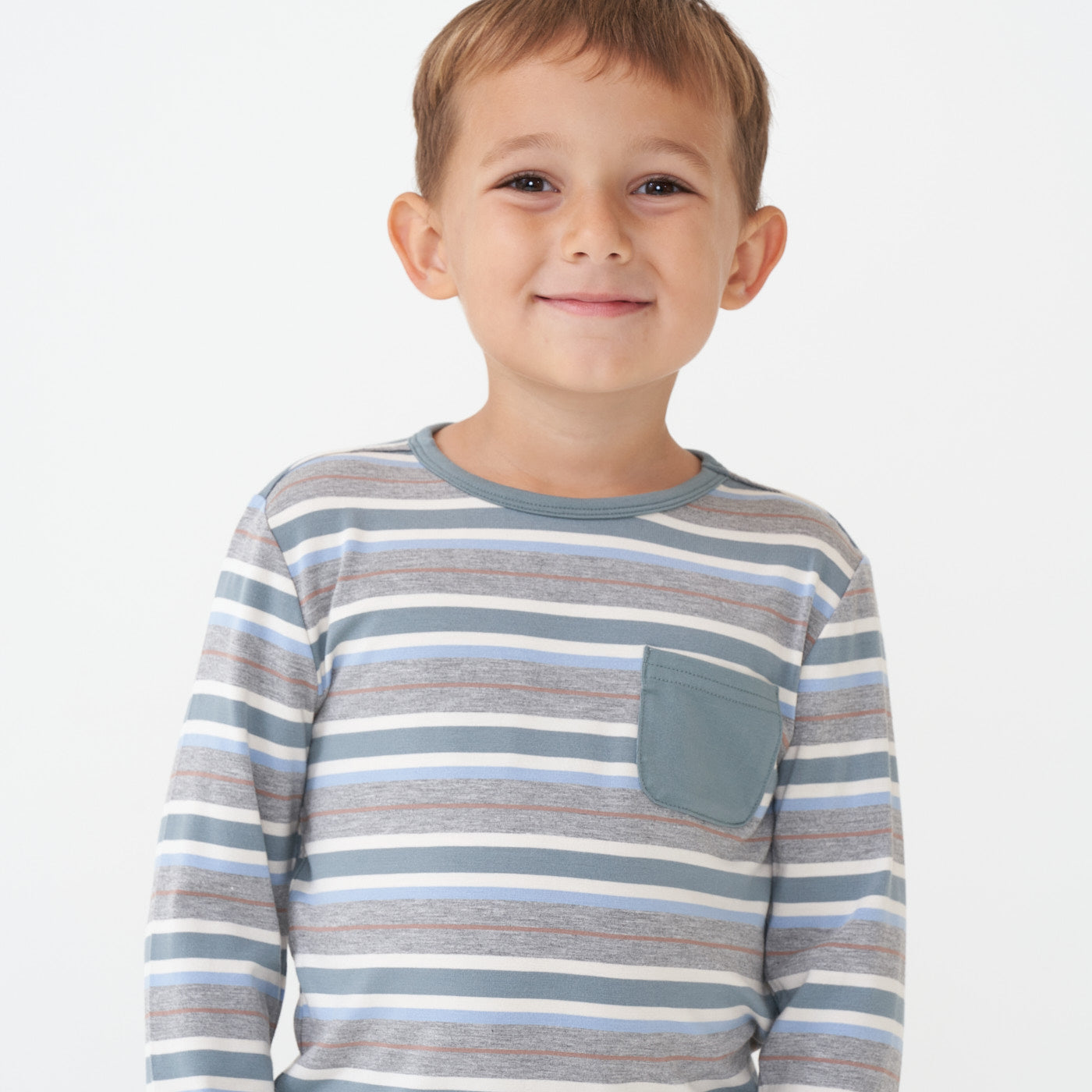 Close up image of a child wearing a Vintage Teal Stripes pocket tee