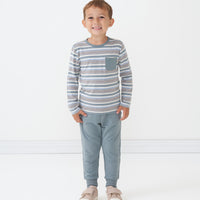 Child wearing a Vintage Teal Stripes pocket tee and coordinating Vintage Teal joggers