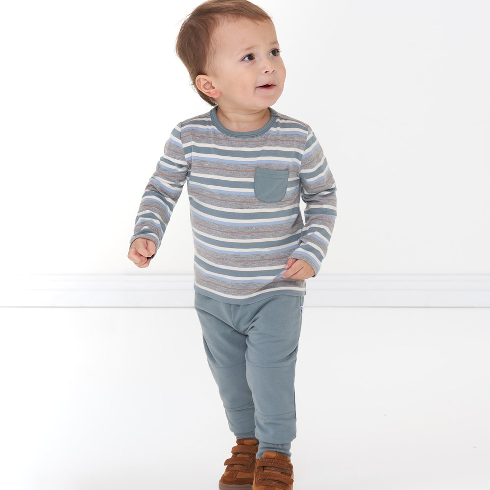 Alternate image of a child wearing a Vintage Teal Stripes pocket tee and coordinating Vintage Teal joggers