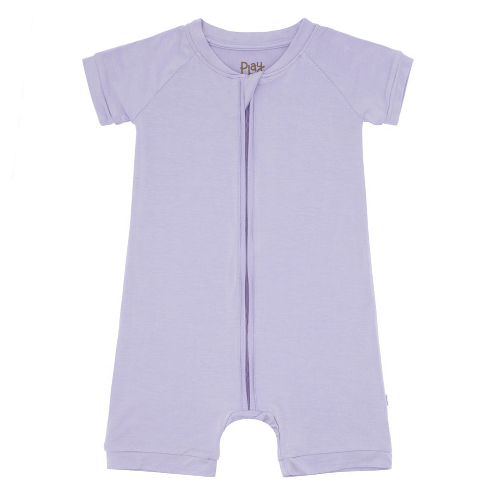 Flat lay image of a Wisteria shorty romper 