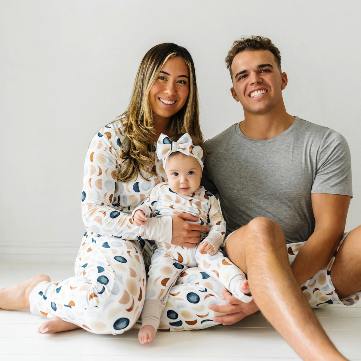 Family of three wearing matching Luna Neutral Women's bamboo Pajamas