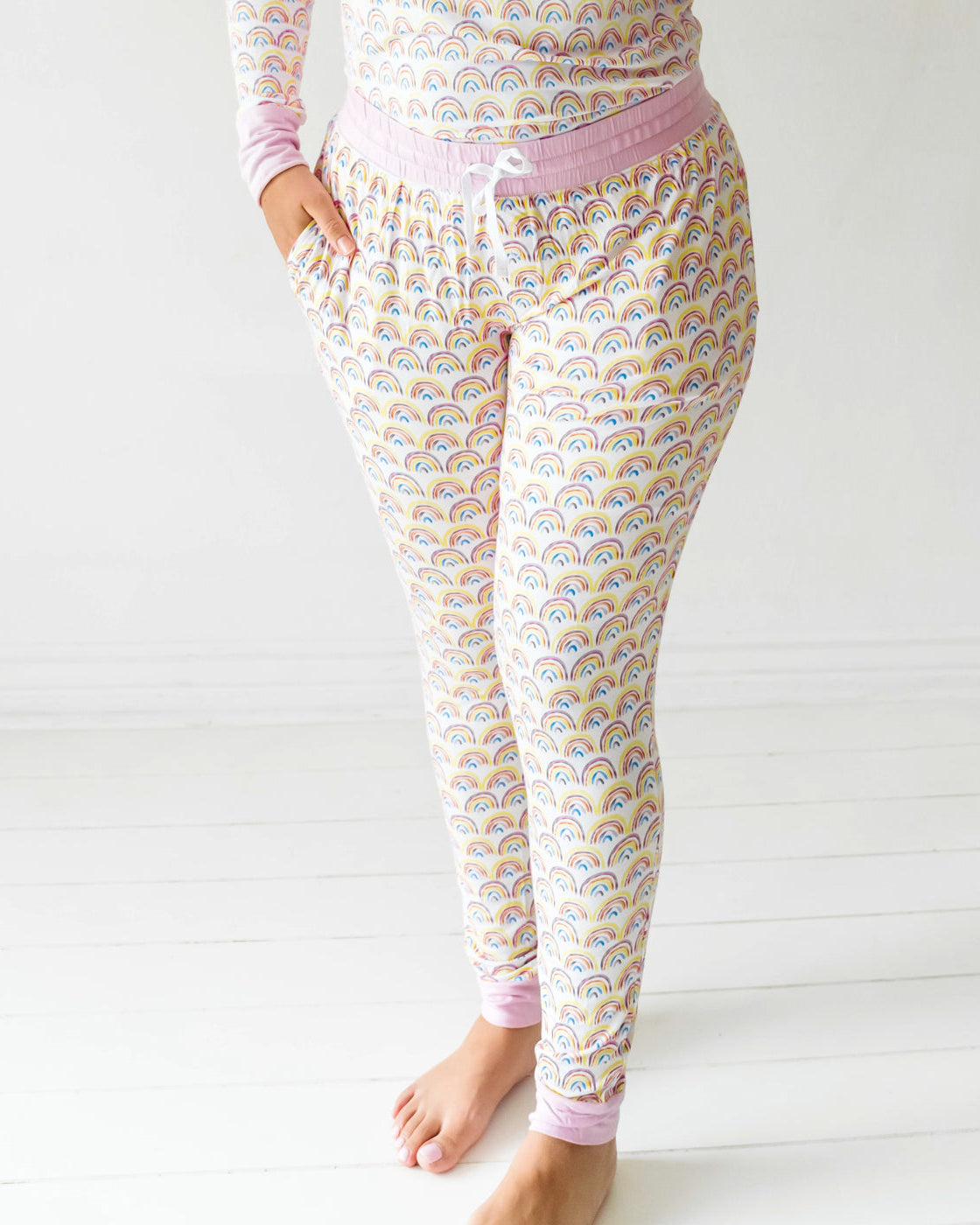 Woman wearing the Pastel Rainbows Women's Pajama Pants