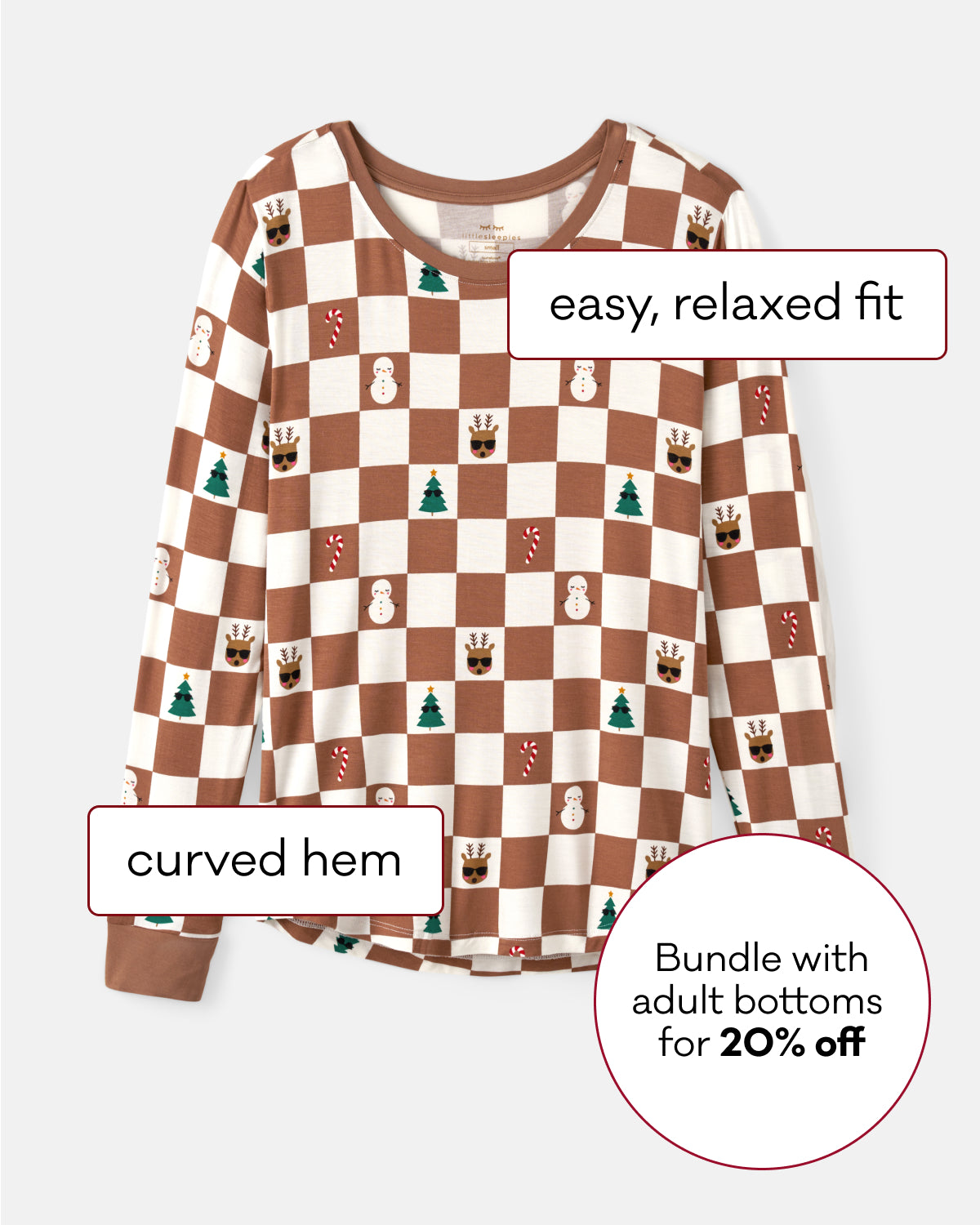 A long-sleeve top with a brown and cream checkerboard pattern decorated with small motifs like snowmen, trees, and candy canes. The image includes text callouts describing the product features: 'easy, relaxed fit', 'curved hem', and a promotional offer 'Bundle with adult bottoms for 20% off'.