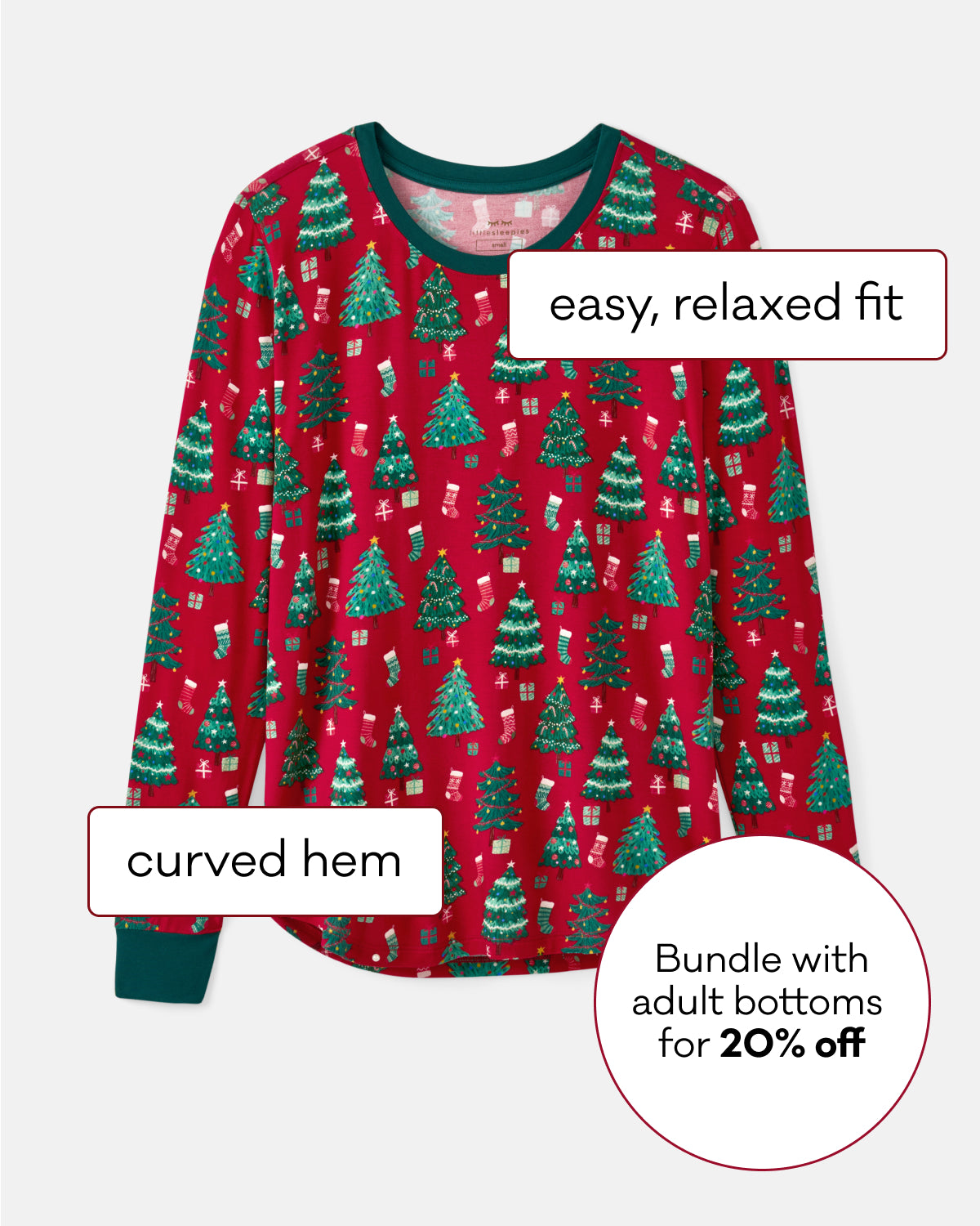 A festive red long-sleeve pajama top with a green Christmas tree pattern, featuring text callouts about its fit and hem, on a light gray background.