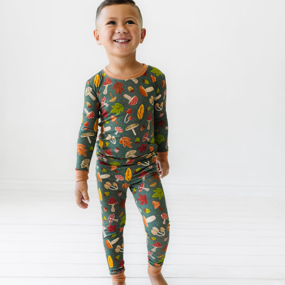 Child wearing a Woodland Forest two-piece pajama set