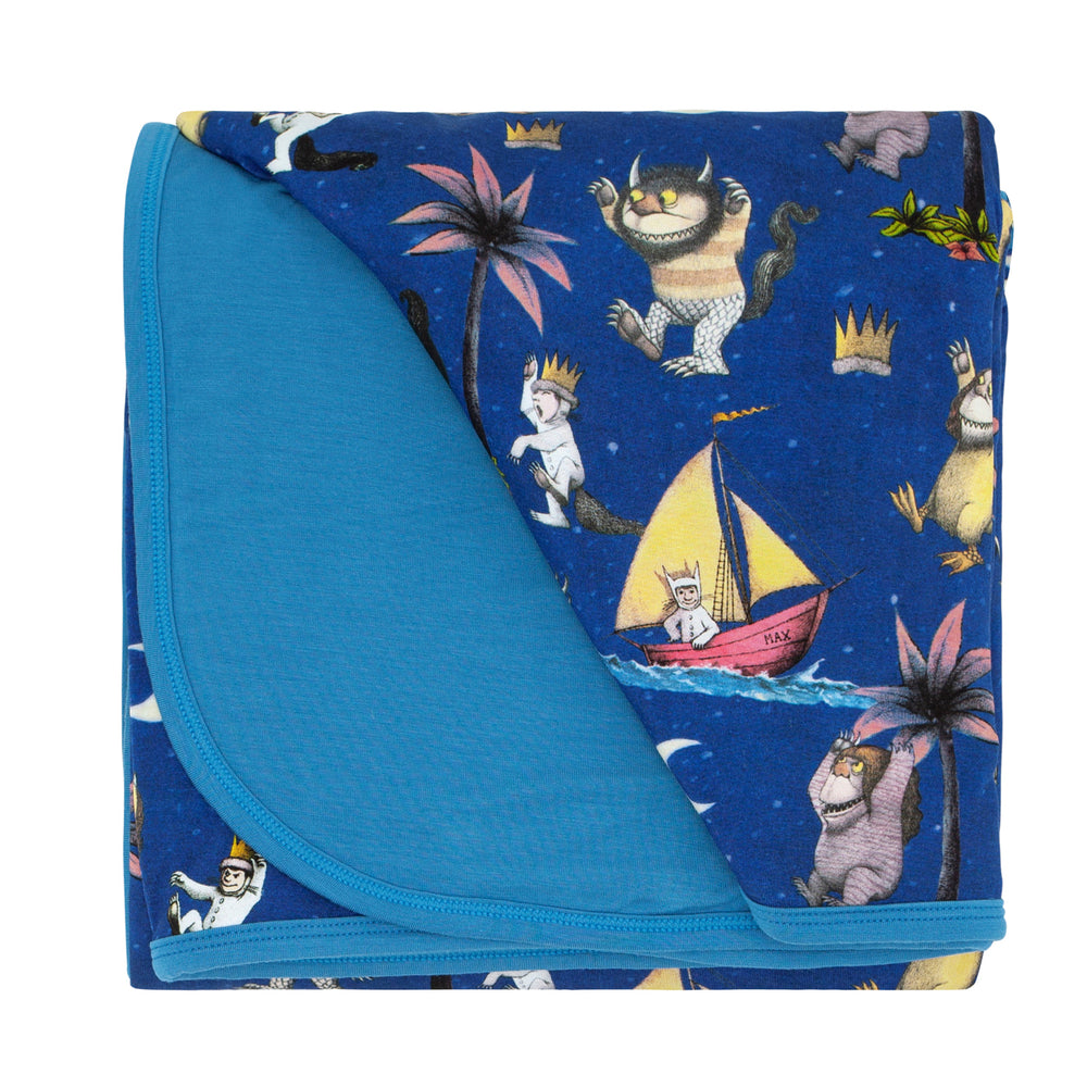Flat lay image of Where the Wild Things Are cloud blanket showing the solid blue backing