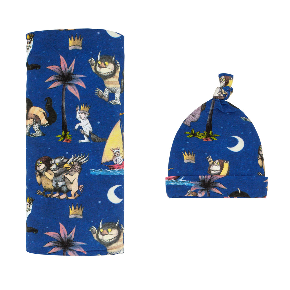 Flat lay image of a Where the Wild Things Are swaddle and hat set