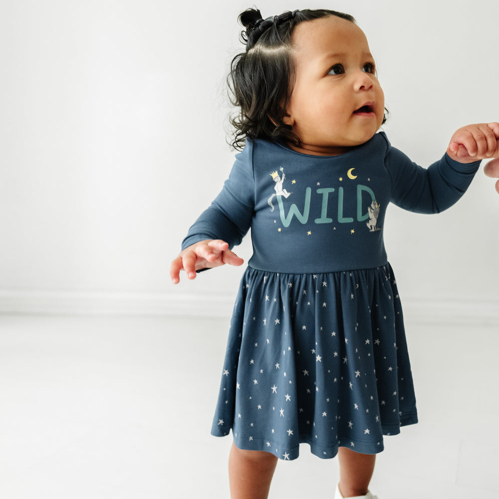 Child wearing a Where the Wild Things Are twirl dress with bodysuit