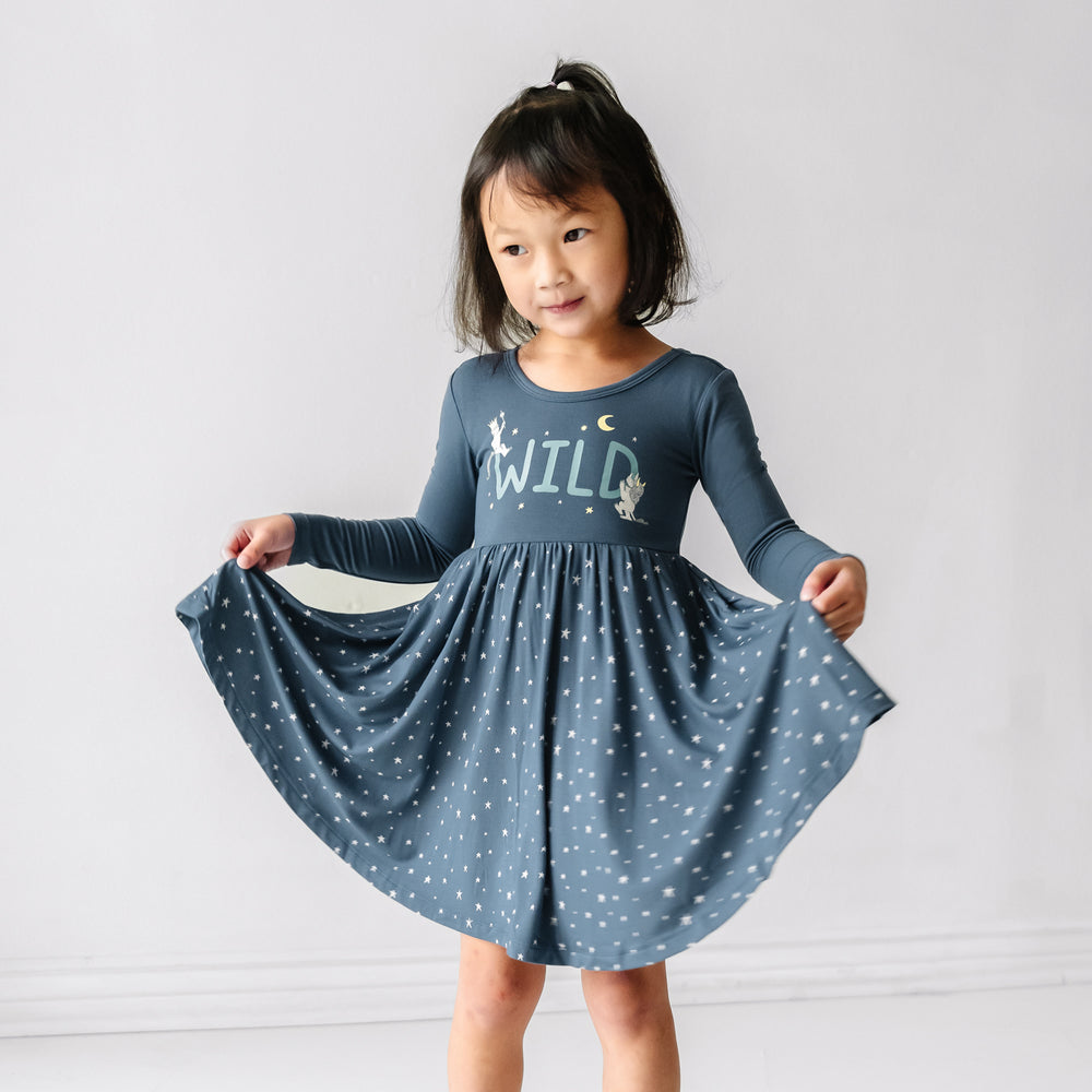 Child posing wearing a Where the Wild Things Are twirl dress