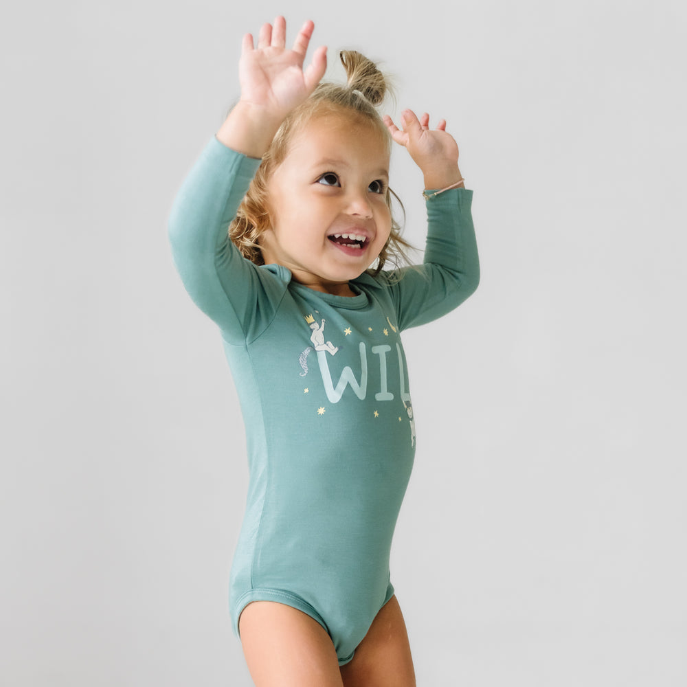 Child playing wearing a Where the Wild Things Are graphic bodysuit