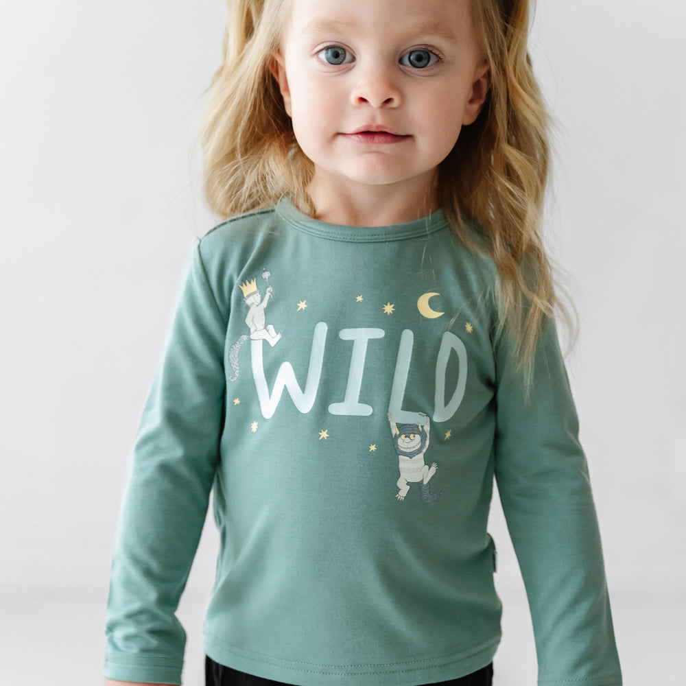 Child wearing a Where the Wild Things Are graphic tee