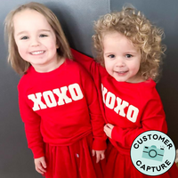 Customer Capture image of two children wearing Candy red Crewnecks and matching candy red tutu skirts