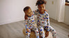 Video of two little boys wearing construction printed pajamas