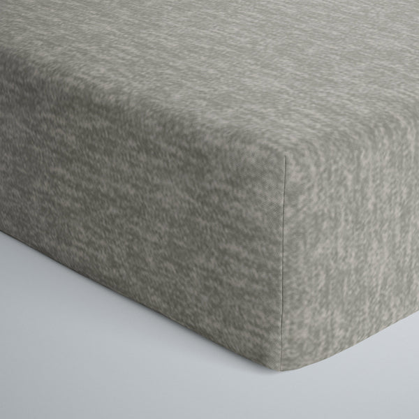 Close up image of infant fitted crib sheet in heather gray. 
