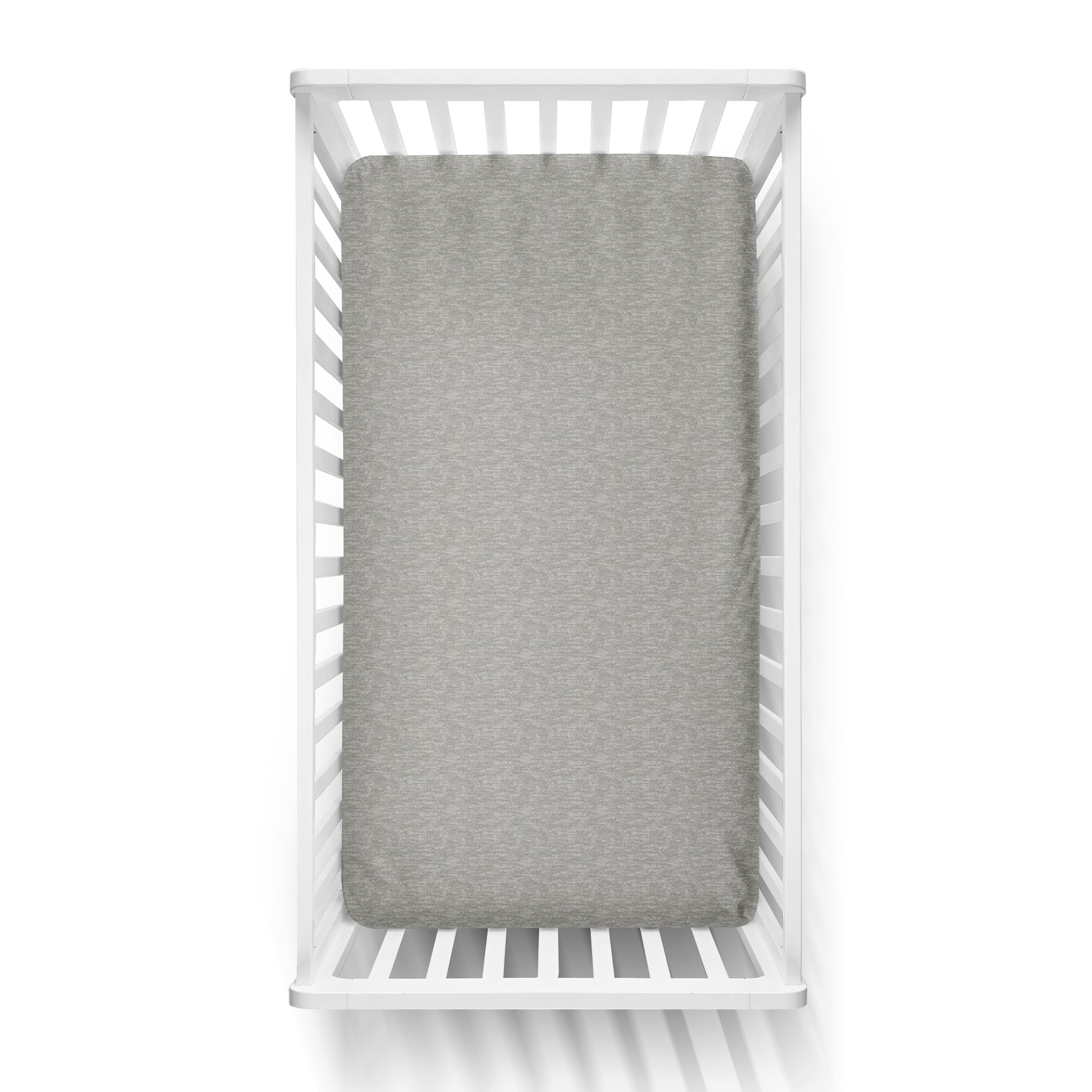 Aerial view of an infant fitted crib sheet in heather gray, photographed in a white crib.
