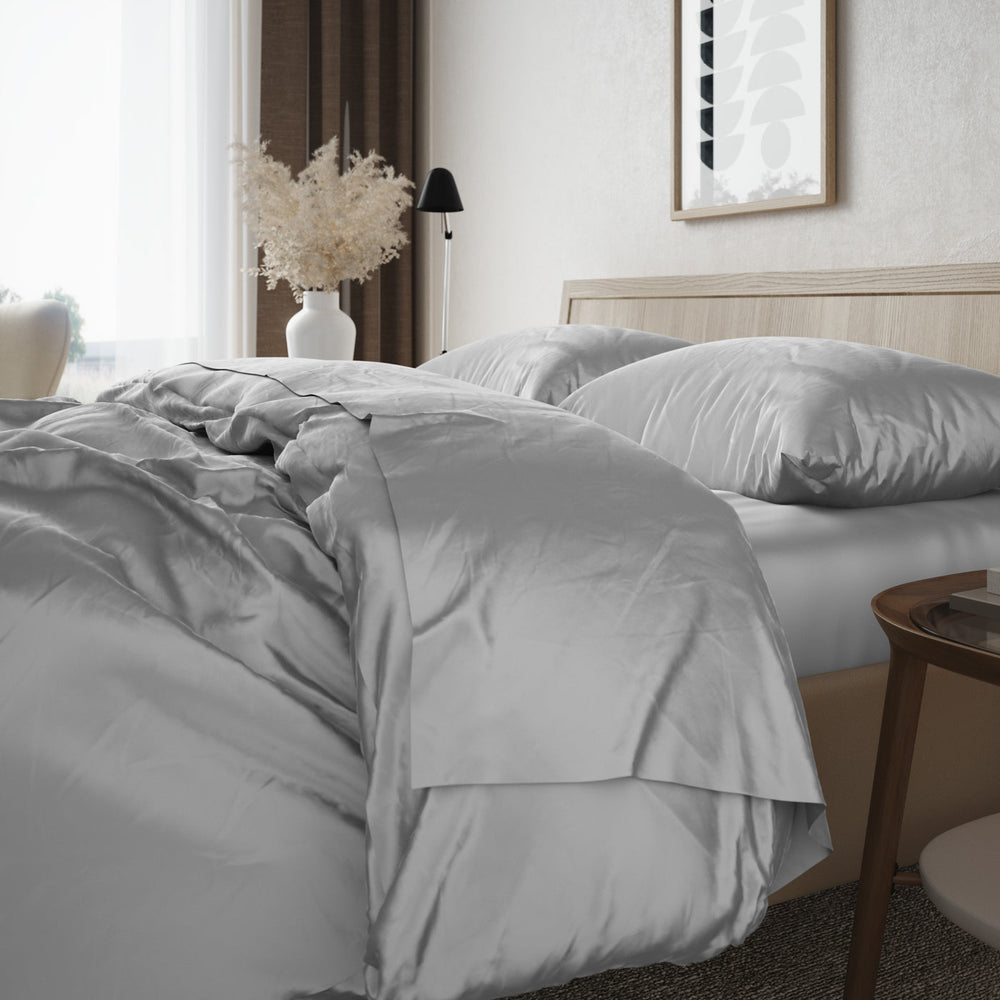 Image of bed turned down with the Bamboo Duvet Cover in Silver