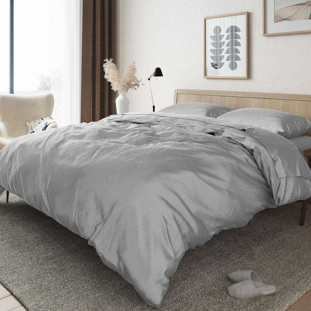 Image of a bedroom with a bed made up with the Bamboo Duvet Cover in Silver
