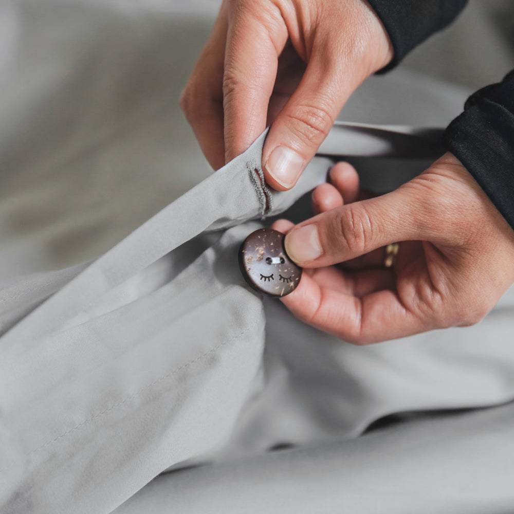 Detail image of buttons that fasten the Bamboo Duvet Cover, in Silver