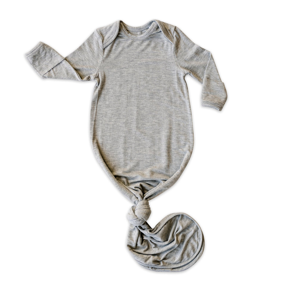 Flat lay photo of infant knotted gown in heather gray