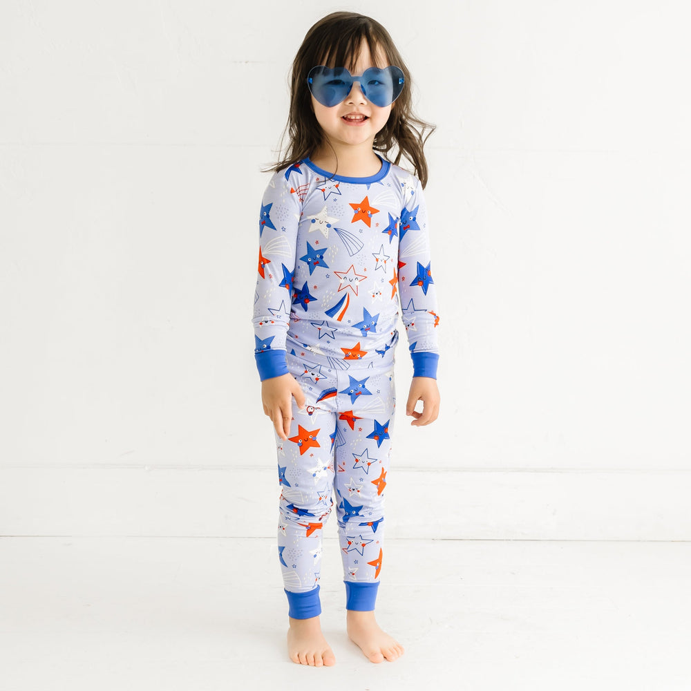 Child wearing a Blue Stars and Stripes printed two piece pajama set