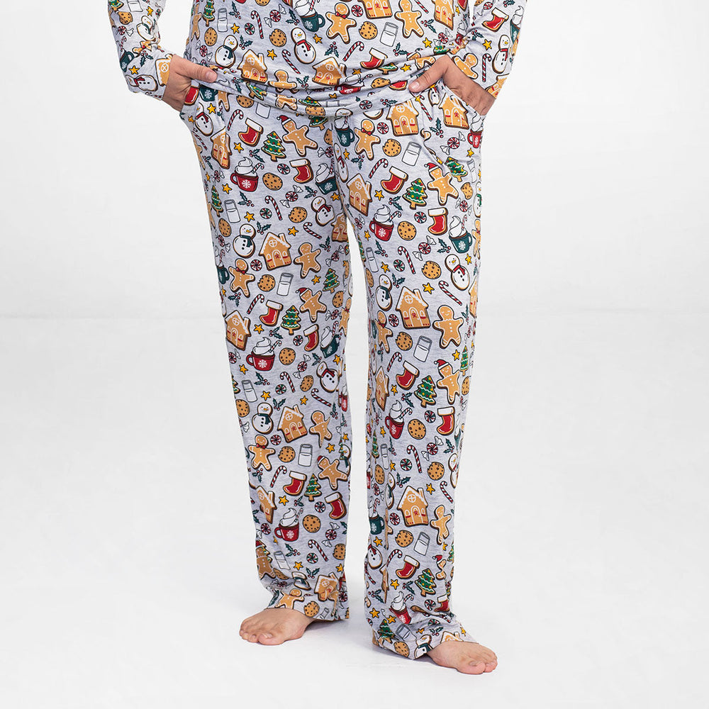 Man wearing Holiday Treats printed men's pajama bottoms