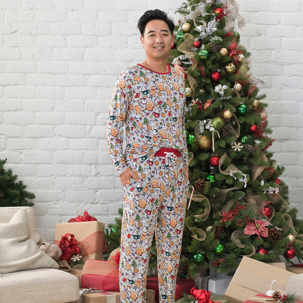 Man wearing Holiday Treats men's pajama top paired with matching men's pajama pants