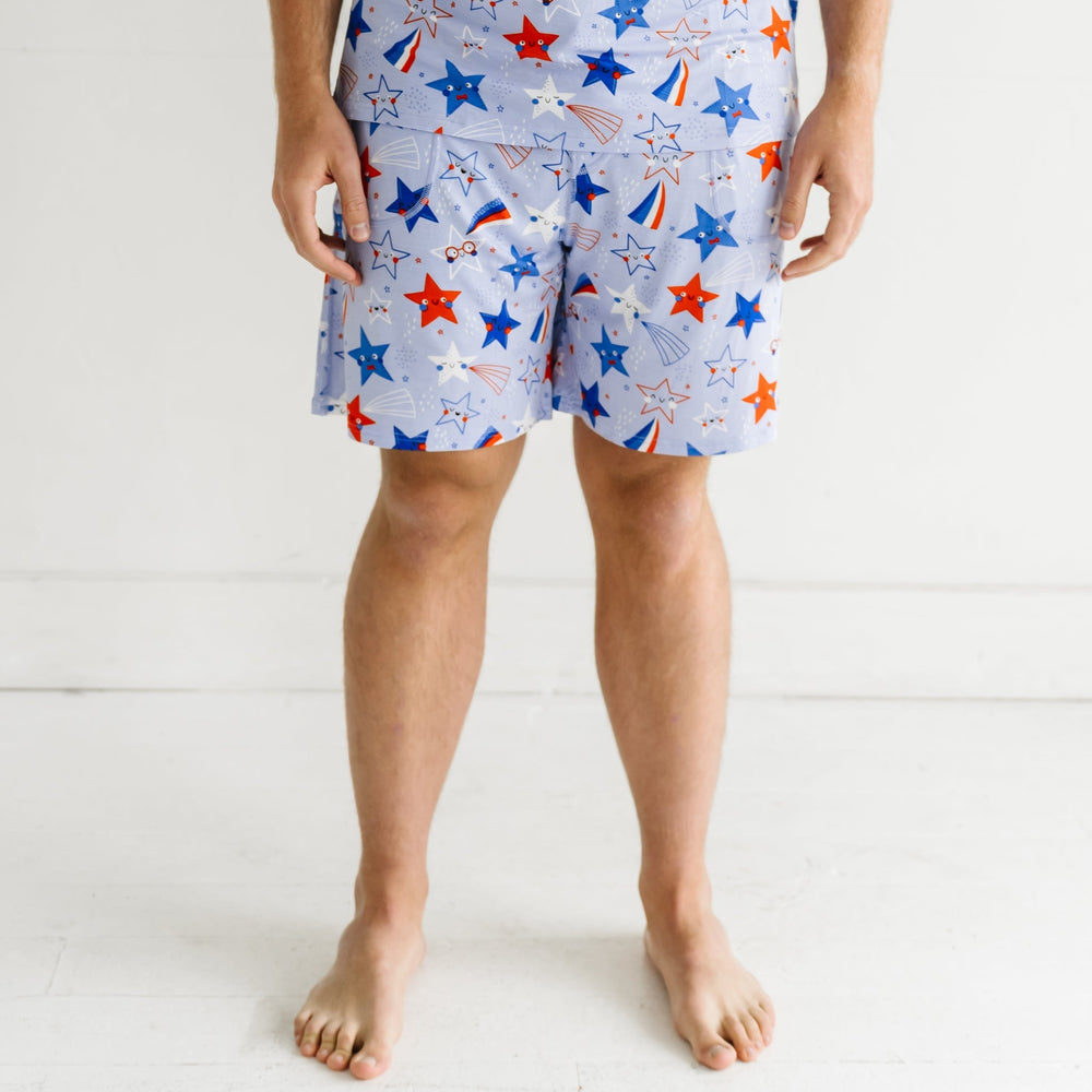Man wearing Blue Stars and Stripes printed men's pajama shorts