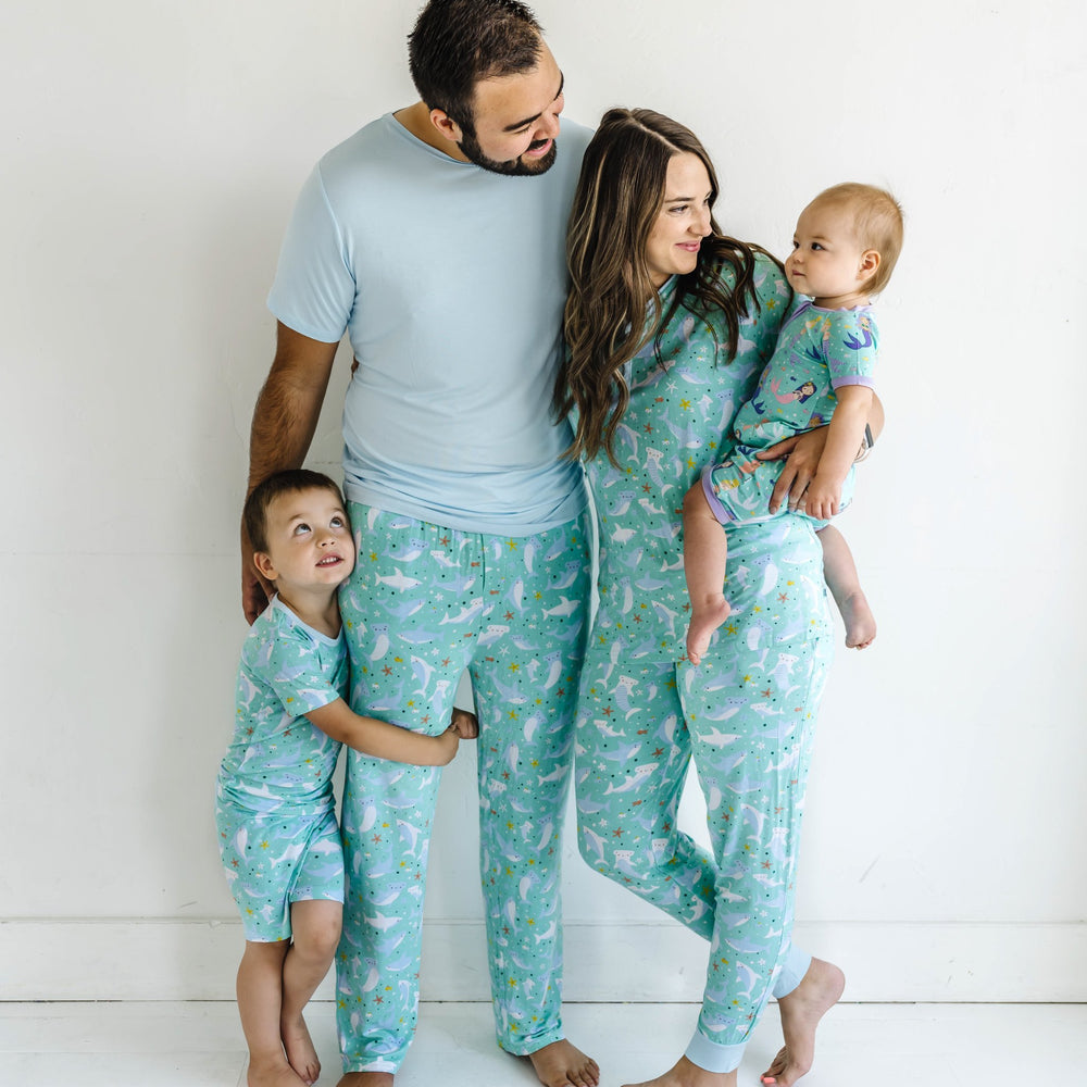 Image of family of four wearing matching pajamas from our Under the Sea collection. 