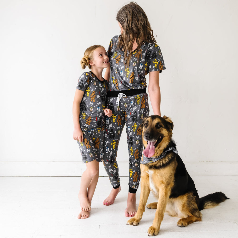 Child in Star Wars™ May the Force Be With You Two-Piece Short Sleeve and Shorts Pajama Set and woman in Star Wars™ May the Force Be With You Short Sleeve Pajama Top and Pajama Pants and dog in Star Wars™ May the Force Be With You Pet Bandana