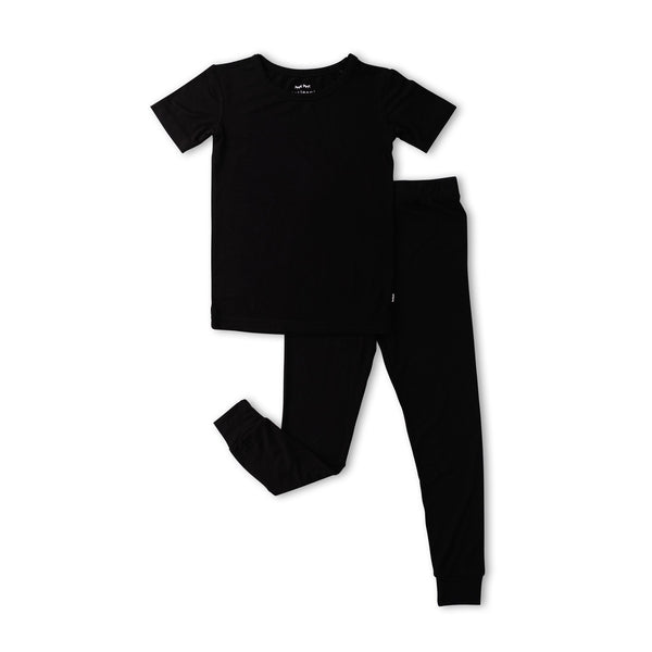 Flat lay image of solid black short sleeve pajama set.