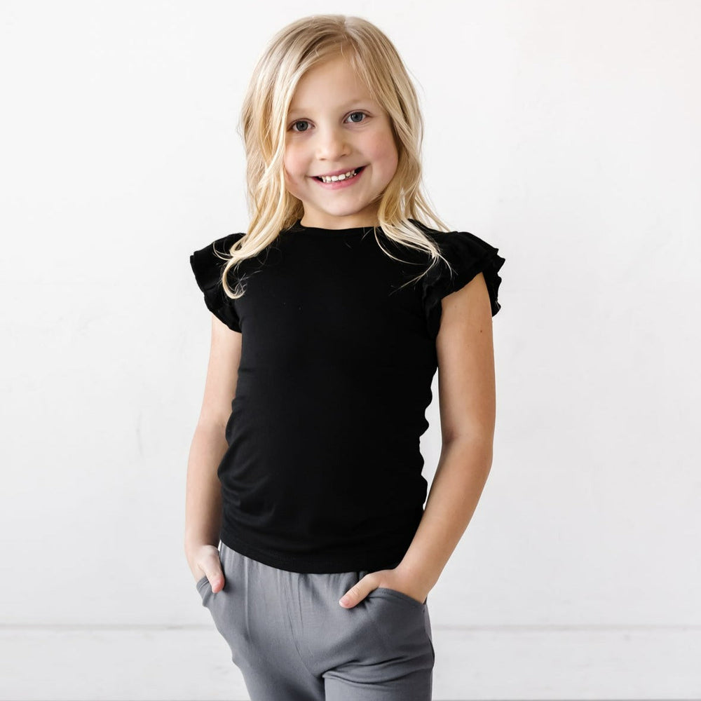 Child in Black Bamboo Viscose Flutter Sleeve Tee from Play by Little Sleepies