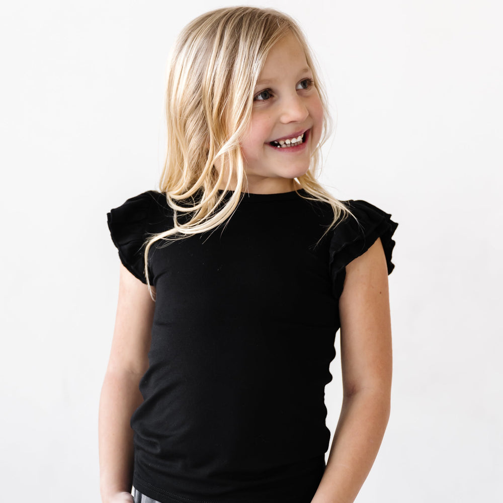Click to see full screen - Child in Black Bamboo Viscose Flutter Sleeve Tee from Play by Little Sleepies