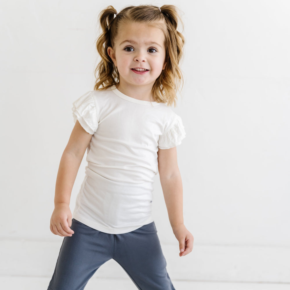 Click to see full screen - Child in White Flutter Sleeve Tee