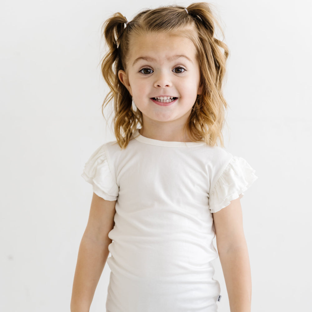 Click to see full screen - Child in White Flutter Sleeve Tee