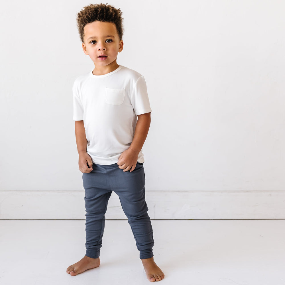 Child in White Short Sleeve Pocket Tee and Charcoal Joggers