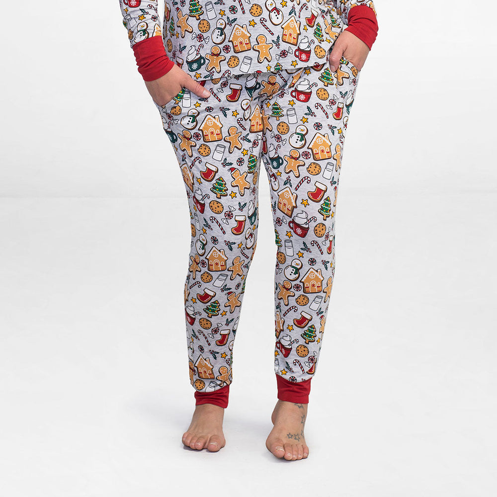 Close up image of a woman wearing Holiday Treats women's pajama pants