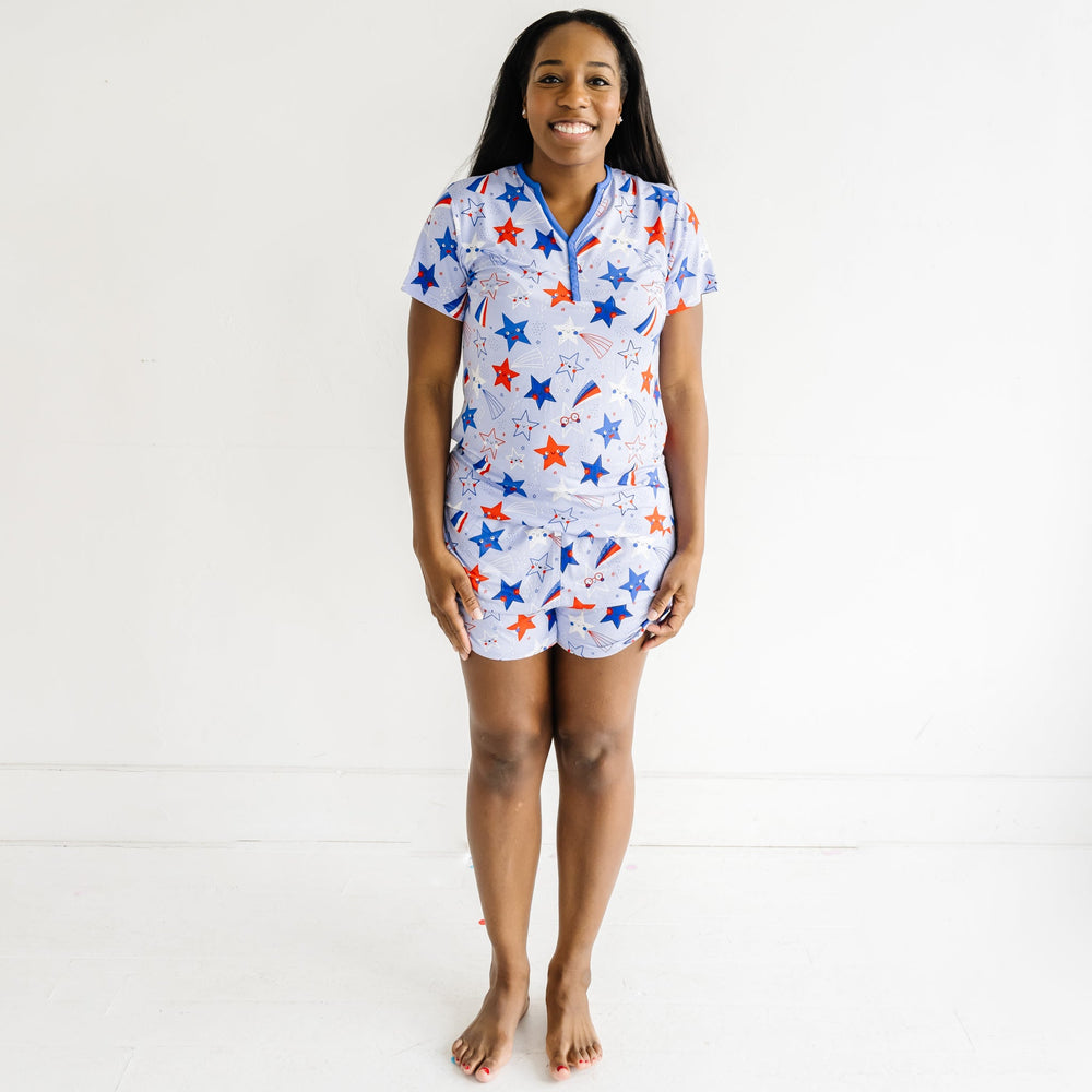 Woman wearing Blue Stars and Stripes printed women's pajama shorts and matching women's pajama top