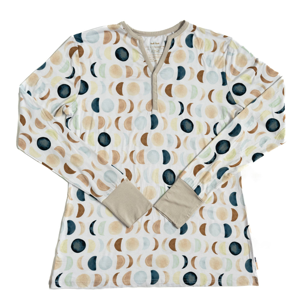Flat lay image of women’s long sleeve pajama top in Luna Neutral print. This print features phases of the moon in the sweetest shades of creams, tans, and navy watercolor in an all over repeat pattern.