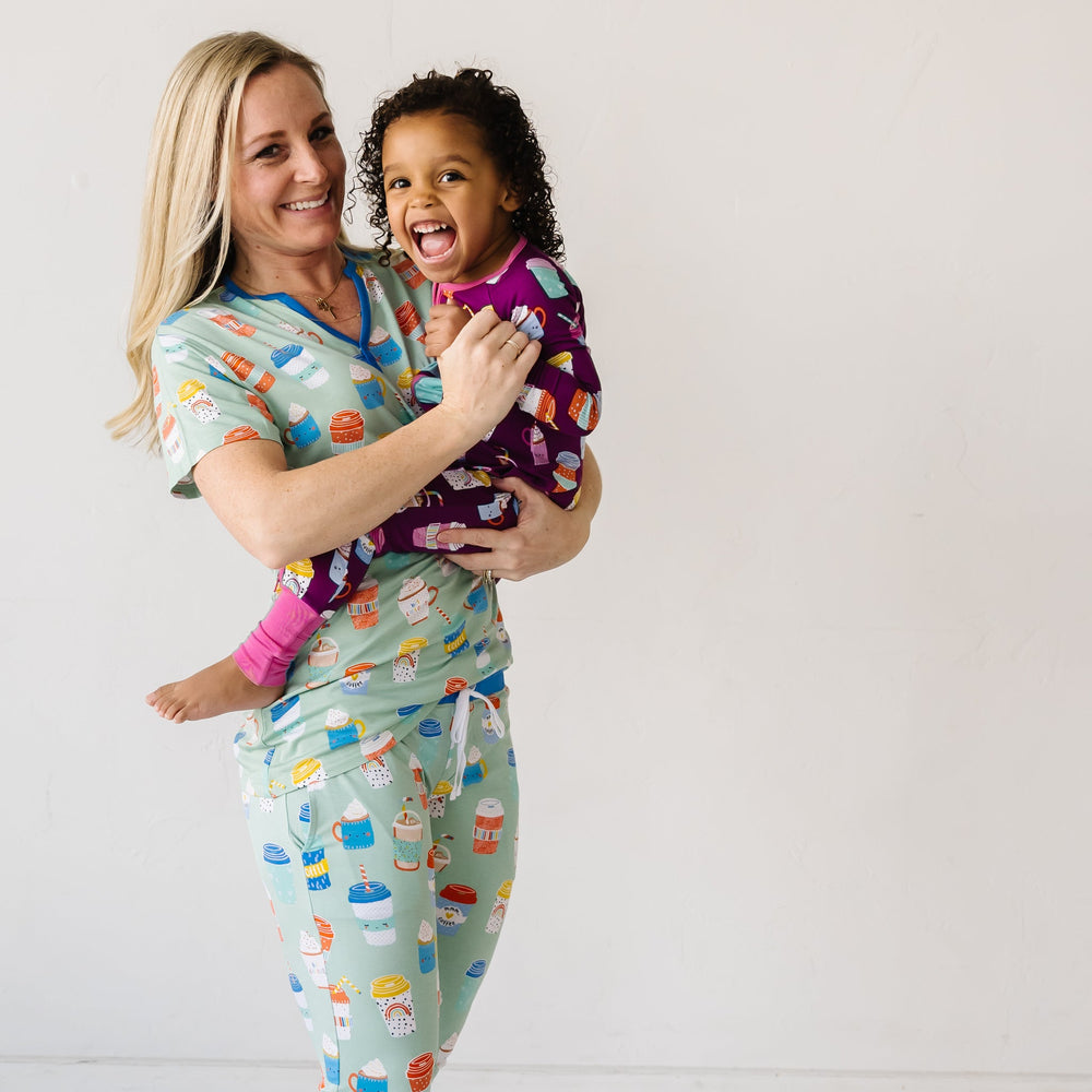 Click to see full screen - Family coordinating and matching pajamas in Women's Aqua I Love You a Latte short sleeve top and pants pajamas and children's Purple I Love You a Latte zippy.