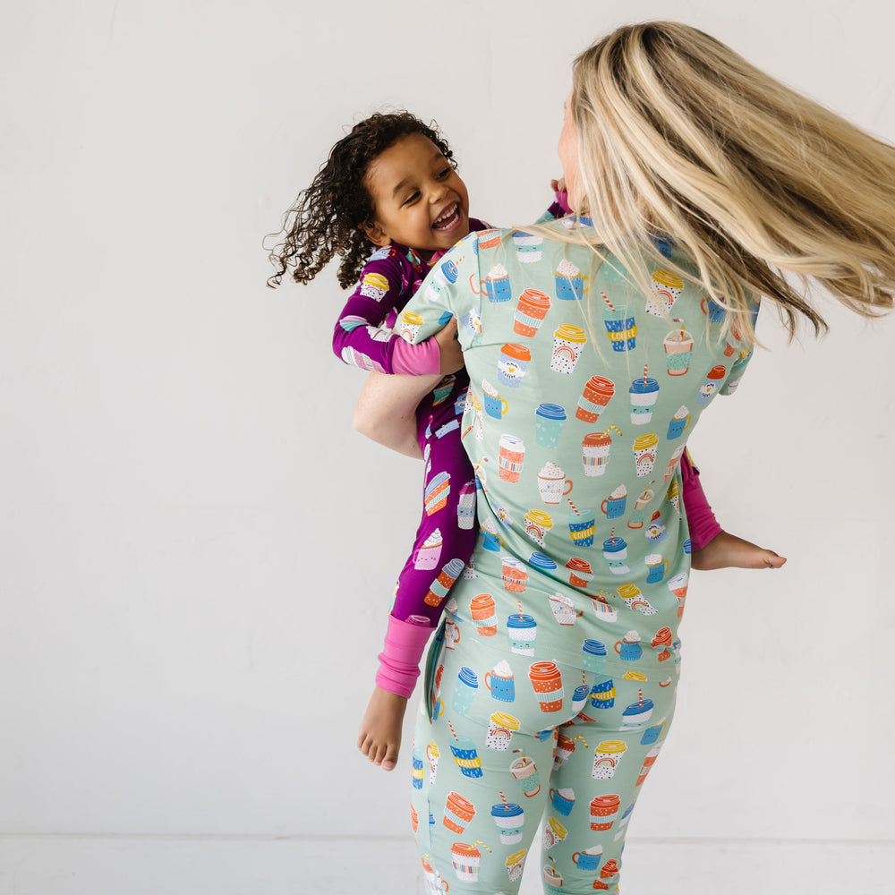 Click to see full screen - Family coordinating and matching pajamas in Women's Aqua I Love You a Latte short sleeve top and pants pajamas and children's Purple I Love You a Latte zippy.