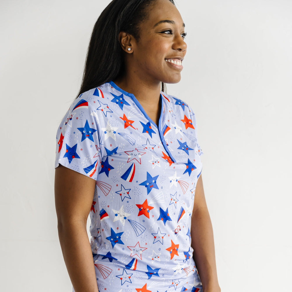 Close up image of a woman wearing a Blue Stars and Stripes printed women's pajama top