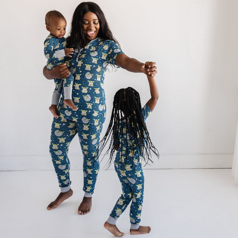 Star Wars™ Grogu family matching pajamas in women's short sleeve top and pants, baby and toddler long sleeve zipper romper, and toddler and kids short sleeve and pants two-piece pajama set.