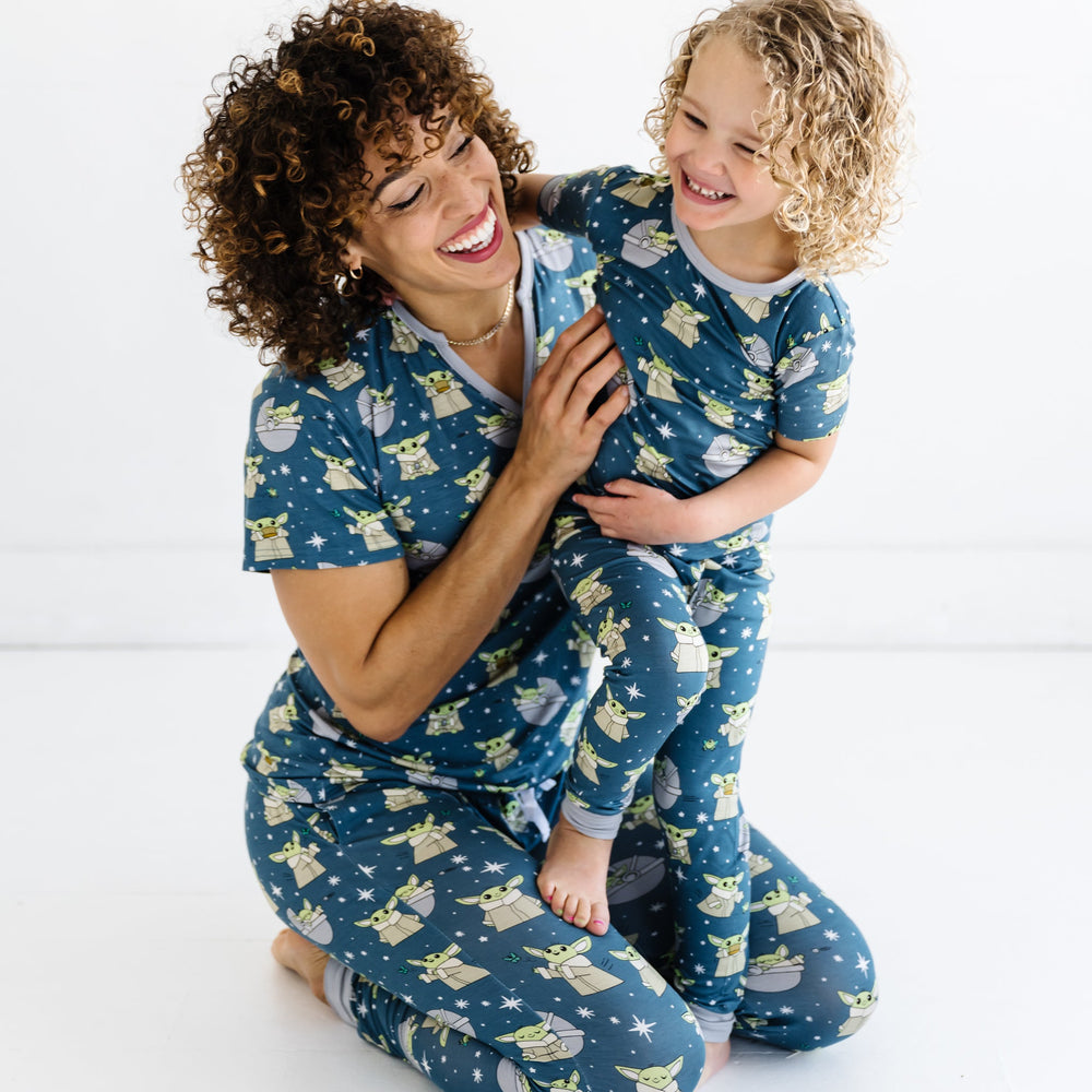 Star Wars™ Grogu family matching pajamas with Women's Short Sleeve Bamboo Viscose Pajama Top and toddler and kid's two-piece short sleeve pajama top and pants set.
