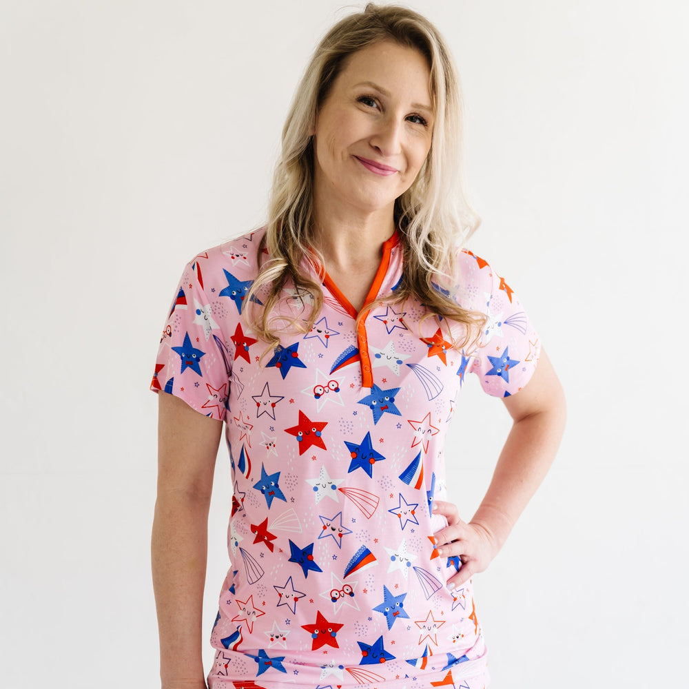 Woman wearing Pink Stars and Stripes printed women's pajama top
