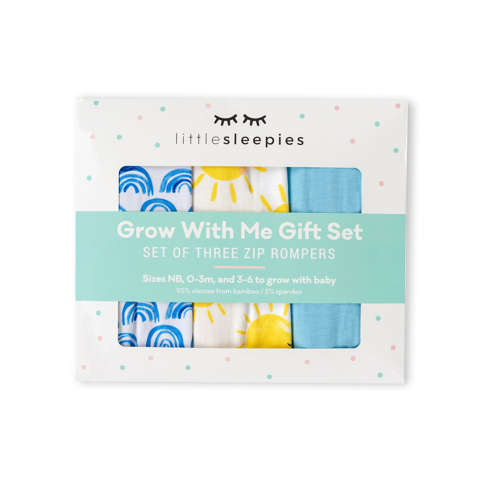 Click to see full screen - Image of Grow With Me gift box containing set of 3 zip up rompers in blue rainbows, sunshine, and sky blue