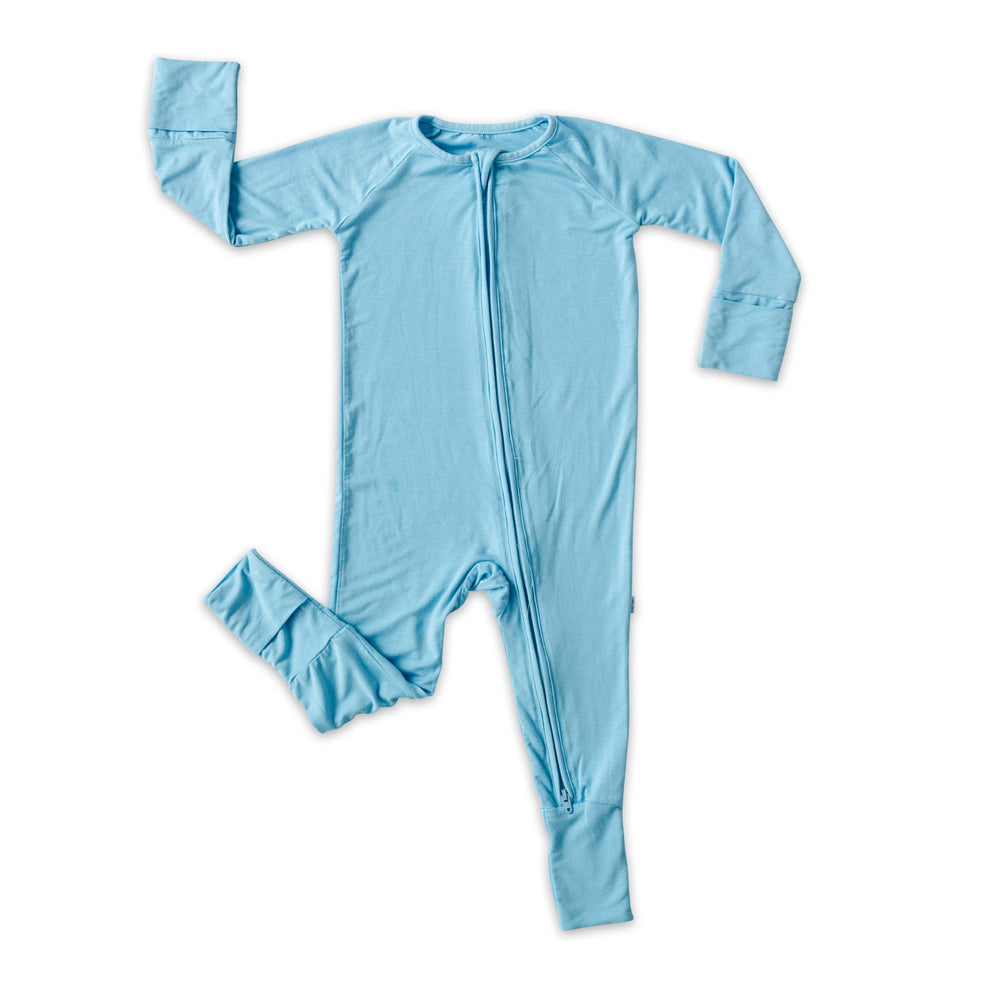 Click to see full screen - Flat lay image of zip up romper in sky blue