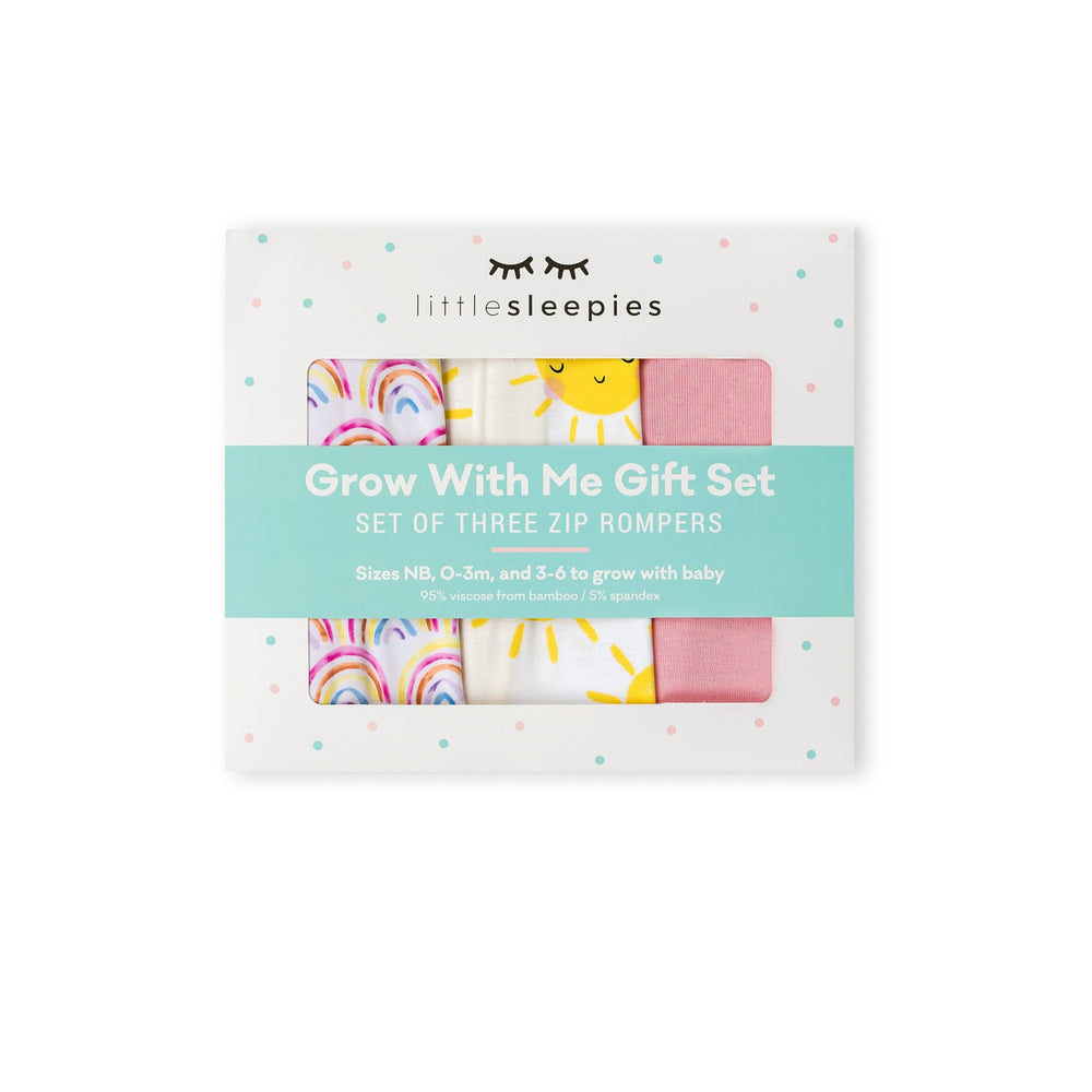 Image of Grow With Me gift box containing set of 3 zip up rompers in pastel rainbows, sunshine, and bubblegum pink