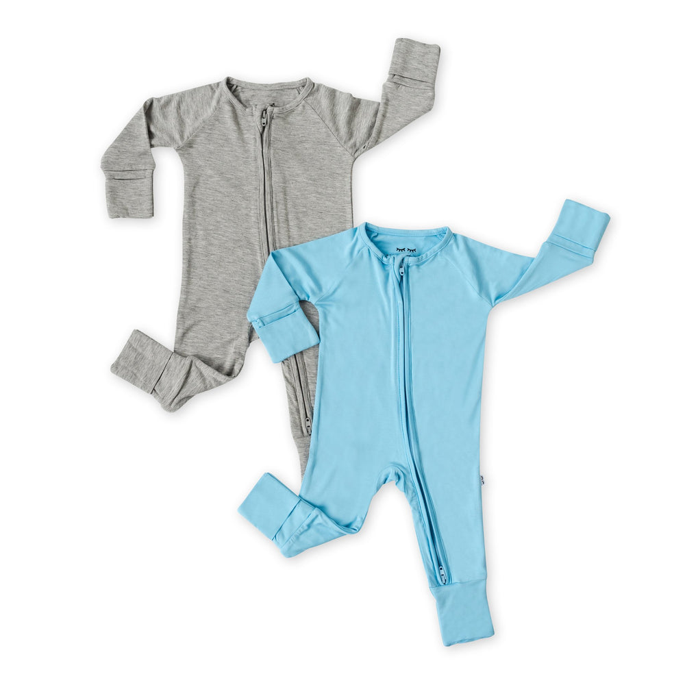Flat lay image of set of 2 solid zip up rompers in heather gray and sky blue.